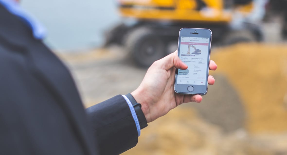 user holds smartphone and performs a usability test on Naxt Sales app prototype